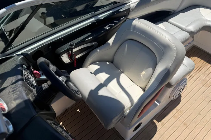 Slide: The Image of 2008 MasterCraft X-45 boat interior with steering wheel and cushioned seating. - 5