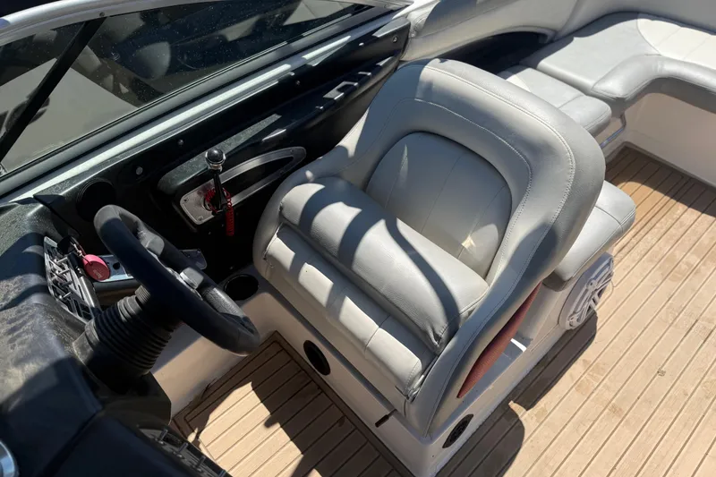 Slide: The Image of 2008 MasterCraft X-45 boat interior with steering wheel and cushioned seating. - 6