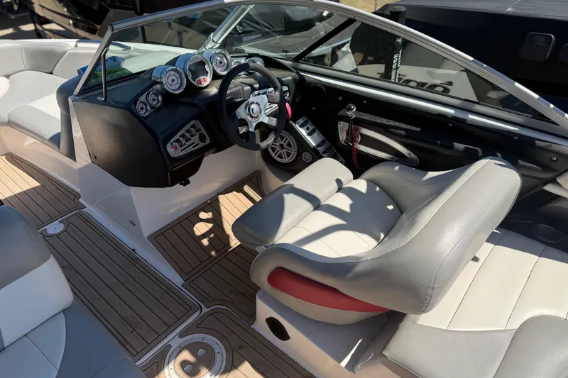 Slide: The Image of 2008 MasterCraft X-45 boat interior with steering wheel and dashboard controls. - 7