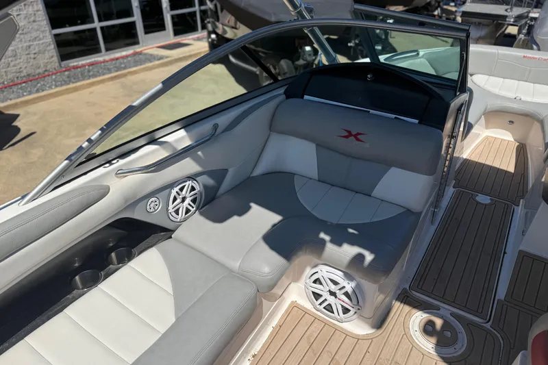 Slide: The Image of Interior of 2008 MasterCraft X-45 boat with gray seating and wood flooring. - 8