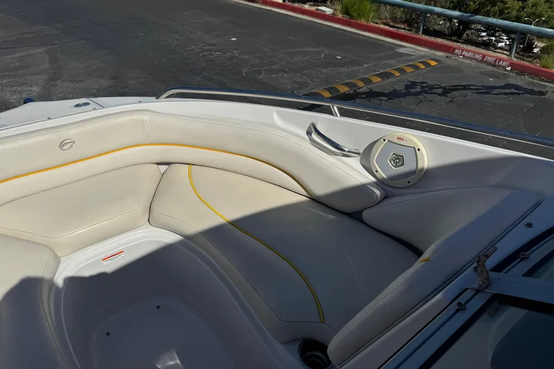 Slide: The Image of Interior of a 2008 Crownline 200 LS boat with white seating and speaker. - 10