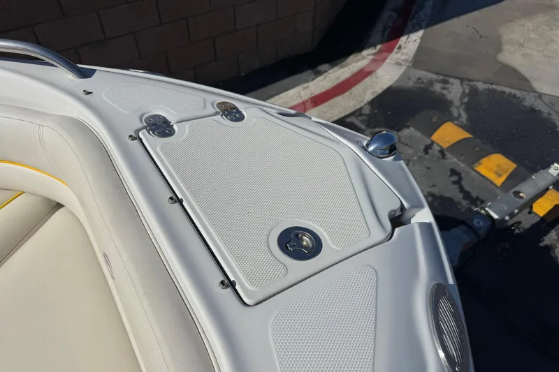 Slide: The Image of 2008 Crownline 200 LS boat bow with white seating and storage compartment. - 12