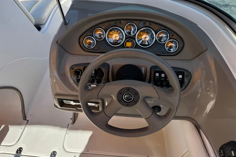 Slide: The Image of Steering console of a 2008 Crownline 200 LS boat with gauges and controls. - 22