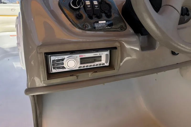 Slide: The Image of 2008 Crownline 200 LS boat dashboard with stereo system and control panel. - 23
