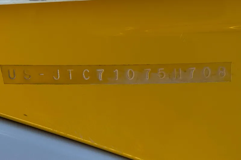 Slide: The Image of Hull identification number on yellow 2008 Crownline 200 LS boat. - 27