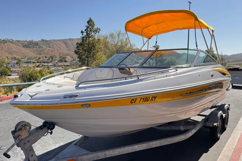Slide: The Image of 2008 Crownline 200 LS boat with yellow canopy on trailer, scenic background. - 3