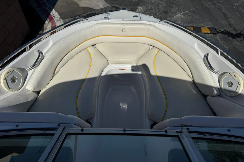 Slide: The Image of Interior view of a 2008 Crownline 200 LS boat with white seating and speakers. - 8