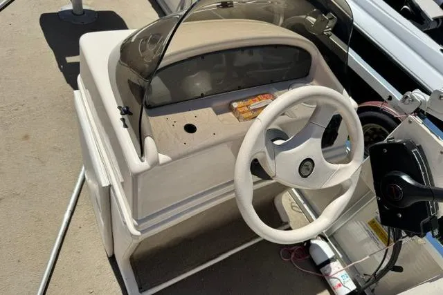 Slide: The Image of 2005 Misty Harbor 1680FS boat console with steering wheel and dashboard. - 11