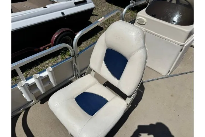 Slide: The Image of 2005 Misty Harbor 1680FS boat seat with blue and white upholstery. - 12