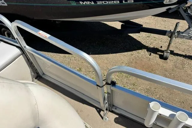 Slide: The Image of 2005 Misty Harbor 1680FS boat interior with aluminum railing and cup holders. - 15