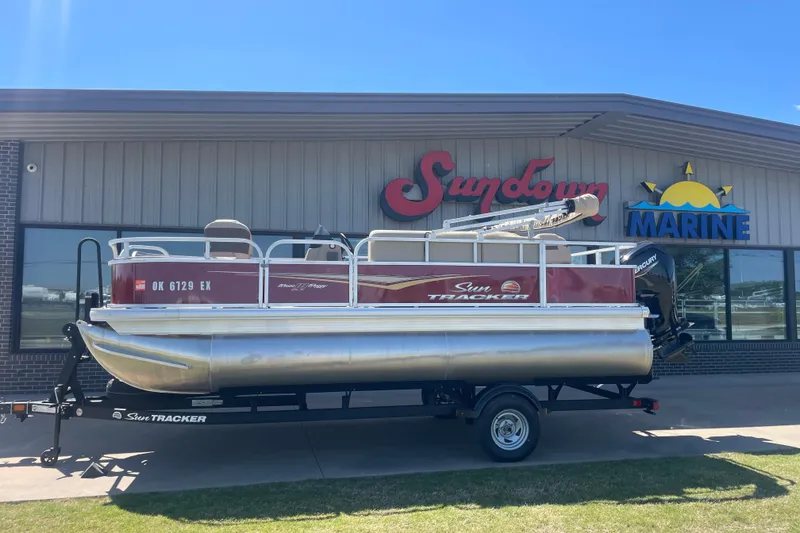 The Image of 2025 SUNTRACKER BASS BUGGY 18 pontoon boat displayed at Sundown Marine dealership. - 0