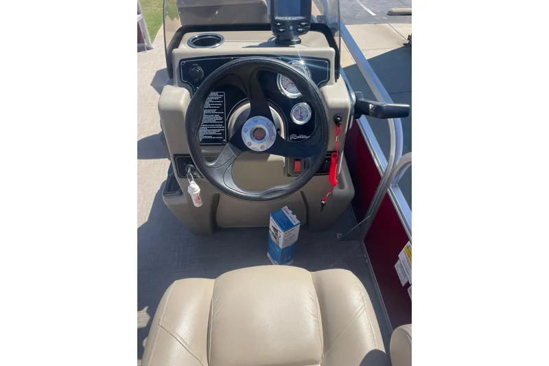 Slide: The Image of Steering console of 2025 SUNTRACKER BASS BUGGY 18 pontoon boat. - 6