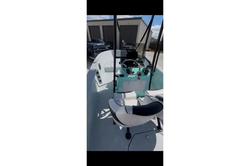 Slide: The Image of 1988 Wellcraft V-20 Sport boat interior with steering wheel and seating. - 4