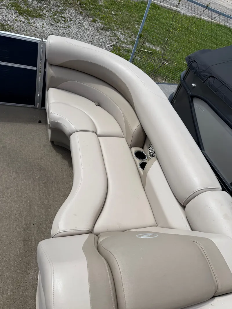 Slide: The Image of Interior of a 2016 Starcraft Stardeck 206 Cruise with beige seating. - 2