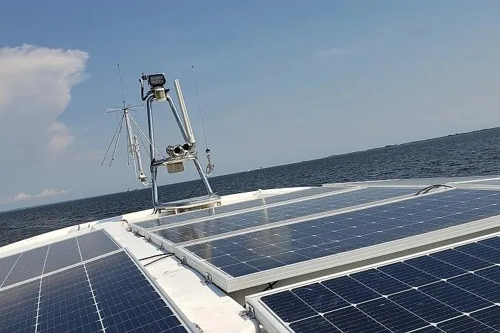 Slide: The Image of Solar panels on Aquila 48 yacht, 2014 model, with ocean backdrop. - 13