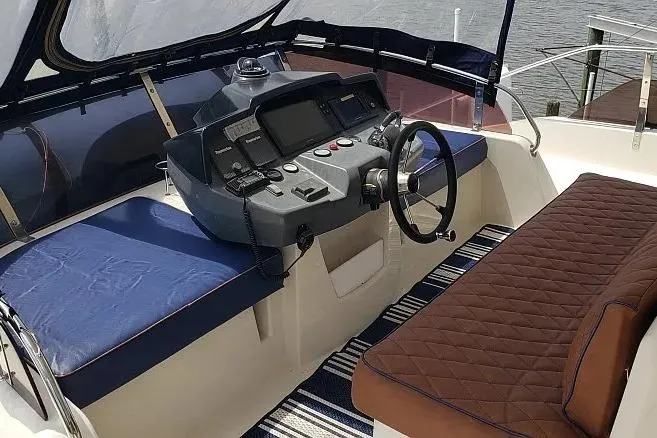 Slide: The Image of Helm of 2014 Aquila 48 yacht with modern controls and comfortable seating. - 7
