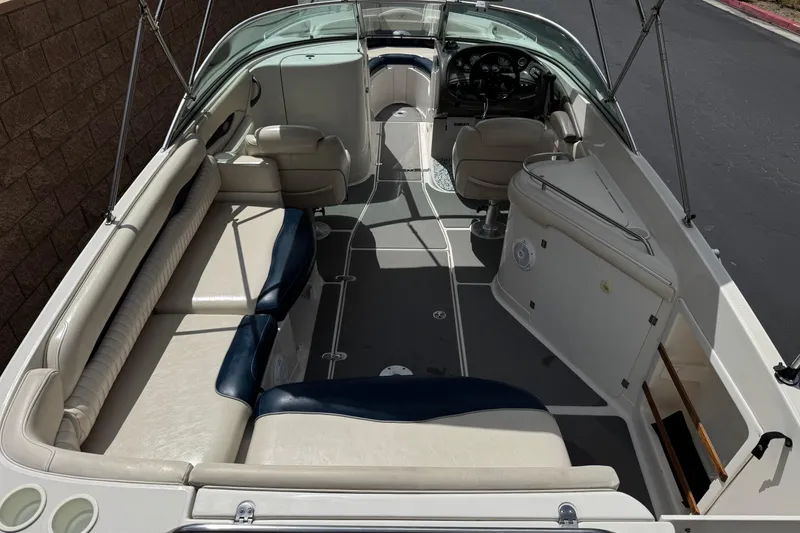 Slide: The Image of 2002 Monterey 248LS Montura Bowrider interior with spacious seating and sleek design. - 10