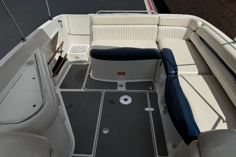 Slide: The Image of 2002 Monterey 248LS Montura Bowrider interior with spacious seating and sleek design. - 16