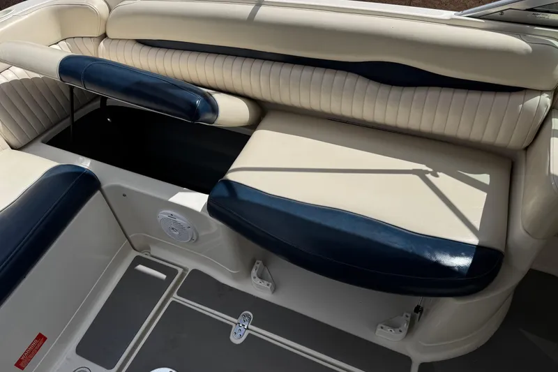 Slide: The Image of 2002 Monterey 248LS Montura Bowrider interior seating with storage compartment. - 20