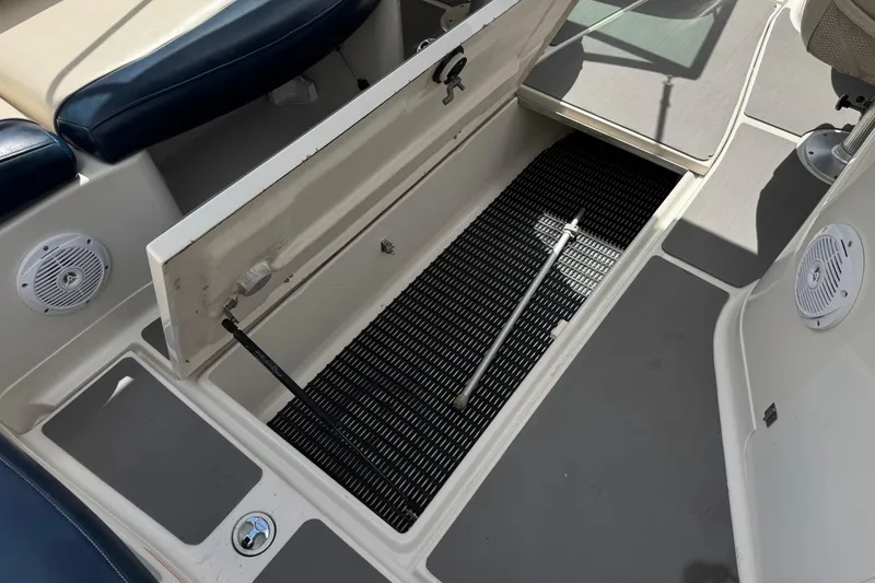 Slide: The Image of Open storage compartment on 2002 Monterey 248LS Montura Bowrider boat interior. - 21