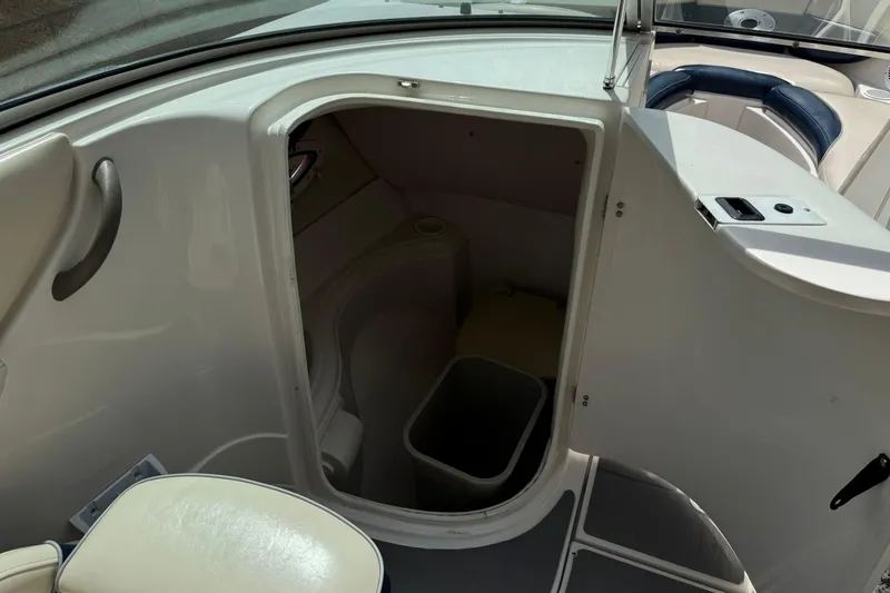 Slide: The Image of 2002 Monterey 248LS Montura Bowrider interior cabin with open storage compartment. - 24