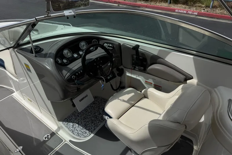 Slide: The Image of 2002 Monterey 248LS Montura Bowrider cockpit with steering wheel and gauges. - 26