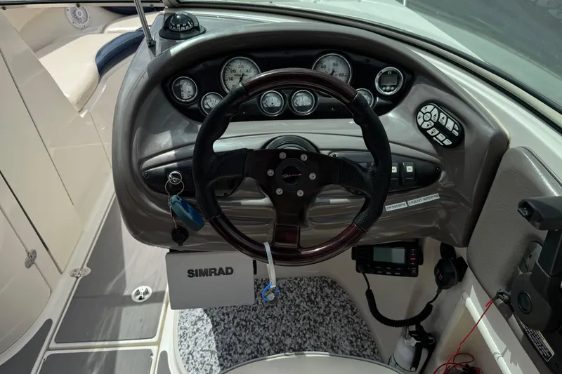 Slide: The Image of Dashboard of a 2002 Monterey 248LS Montura Bowrider with steering wheel and gauges. - 27