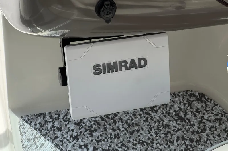 Slide: The Image of Simrad device installed on 2002 Monterey 248LS Montura Bowrider boat interior. - 28