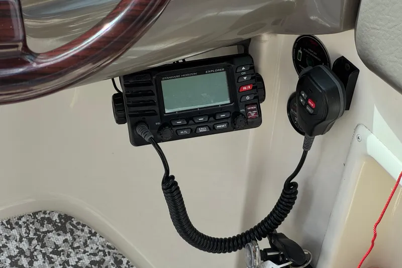Slide: The Image of Boat dashboard with Standard Horizon radio, Monterey 248LS Montura Bowrider, 2002 model. - 29