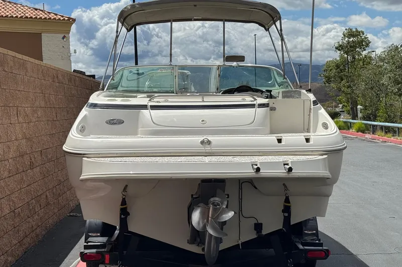 Slide: The Image of 2002 Monterey 248LS Montura Bowrider boat on trailer, rear view, outdoors. - 4