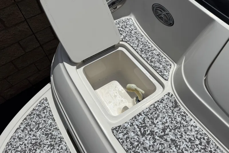 Slide: The Image of Open storage compartment on 2002 Monterey 248LS Montura Bowrider boat deck. - 8