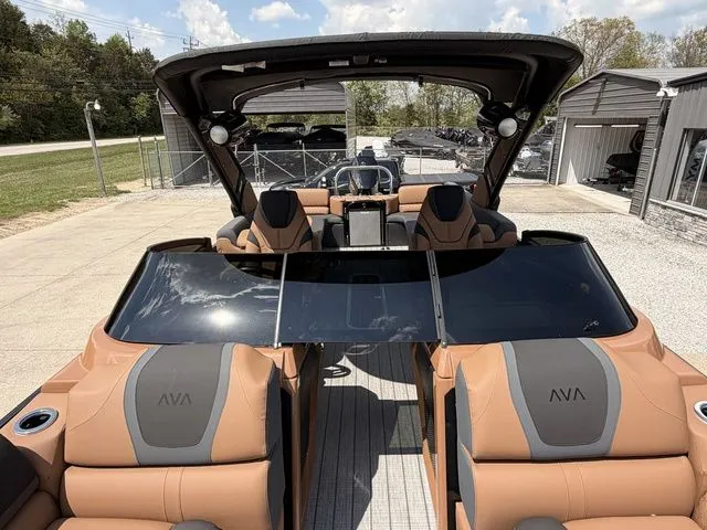 Slide: The Image of Luxurious Avalon Catalina Quad Lounger boat, 2026 model, featuring windshield. - 11