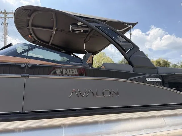 Slide: The Image of 2026 Avalon Catalina Quad Lounger boat with windshield, side view. - 14