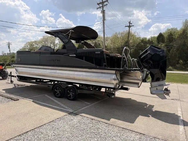 Slide: The Image of 2026 Avalon Catalina Quad Lounger boat on trailer, sunny day. - 15