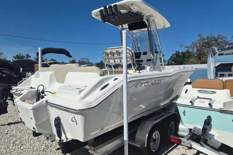 The Image of 2026 Key West 239 FS boat on trailer, displayed outdoors under clear blue sky. - 1
