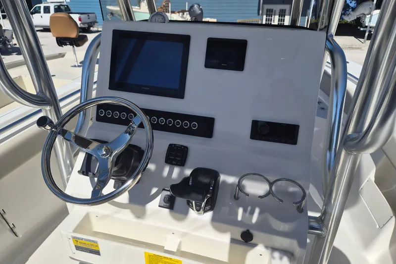 Slide: The Image of Steering console of 2026 Key West 239 FS boat with modern controls and display. - 10