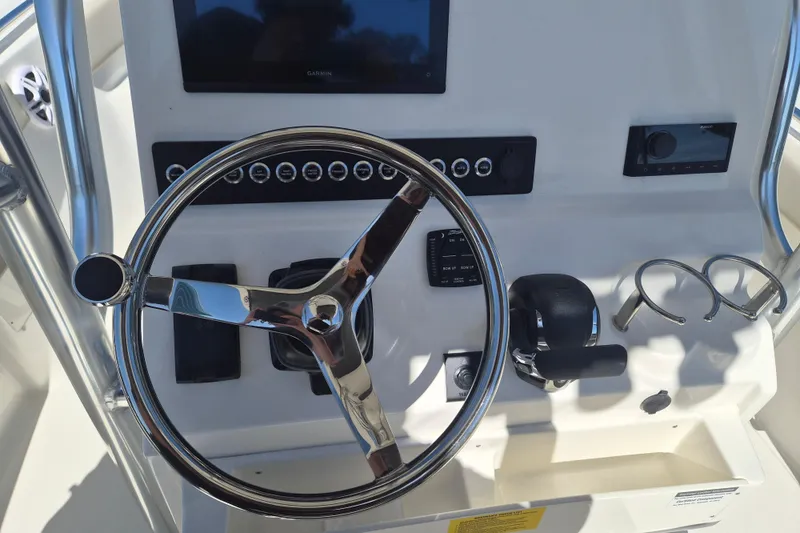 Slide: The Image of Steering console of 2026 Key West 239 FS boat with modern controls and displays. - 11