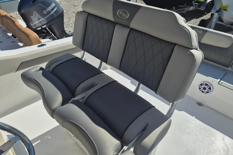 Slide: The Image of 2026 Key West 239 FS boat interior with cushioned seating and Yamaha engine. - 12