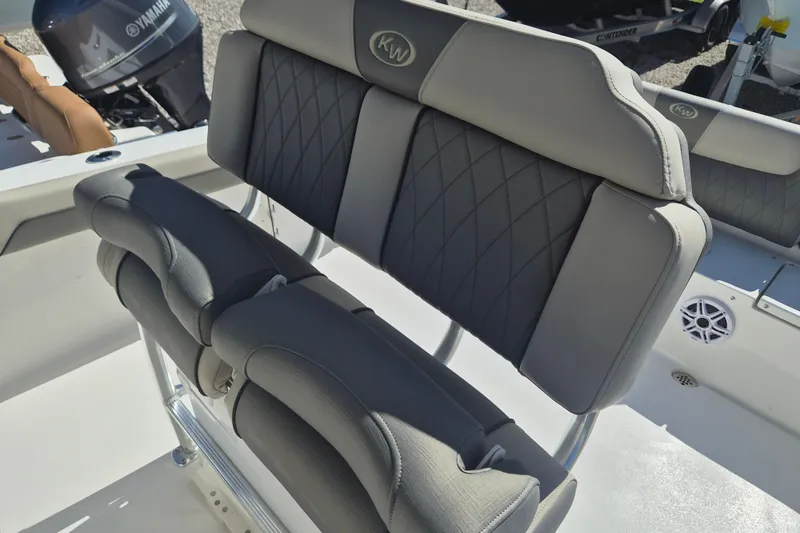 Slide: The Image of 2026 Key West 239 FS boat seating with Yamaha engine in background. - 13