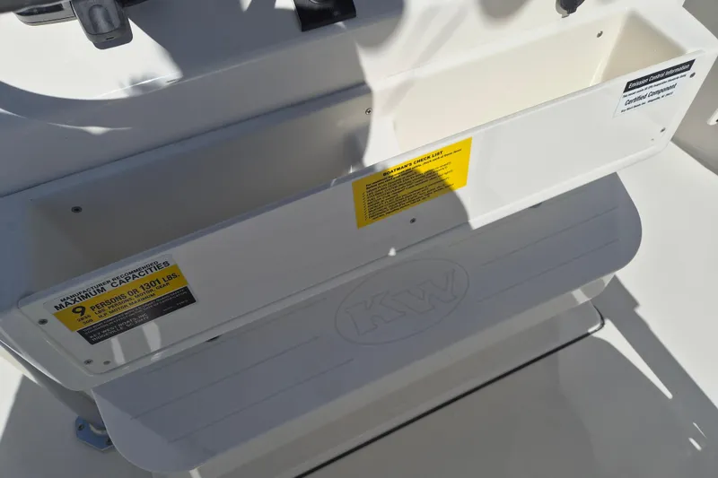 Slide: The Image of 2026 Key West 239 FS boat interior with capacity label for nine persons or 1301 lbs. - 14