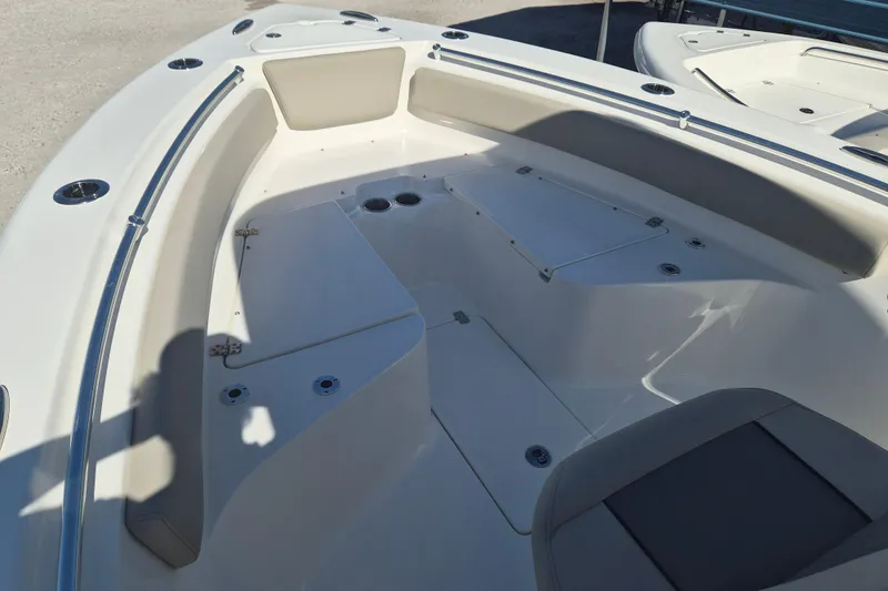 Slide: The Image of 2026 Key West 239 FS boat interior with seating and storage compartments. - 18