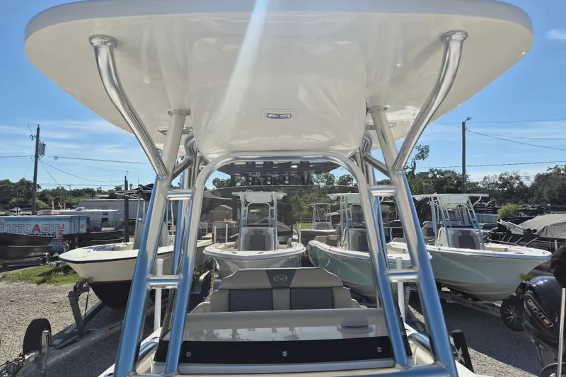 Slide: The Image of 2026 Key West 239 FS boat displayed in a marina under clear blue skies. - 21