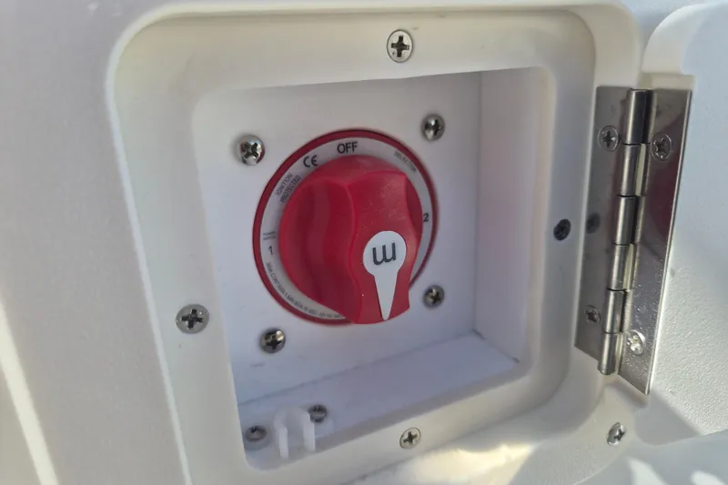 Slide: The Image of Battery switch on a 2026 Key West 239 FS boat, featuring a red dial. - 23