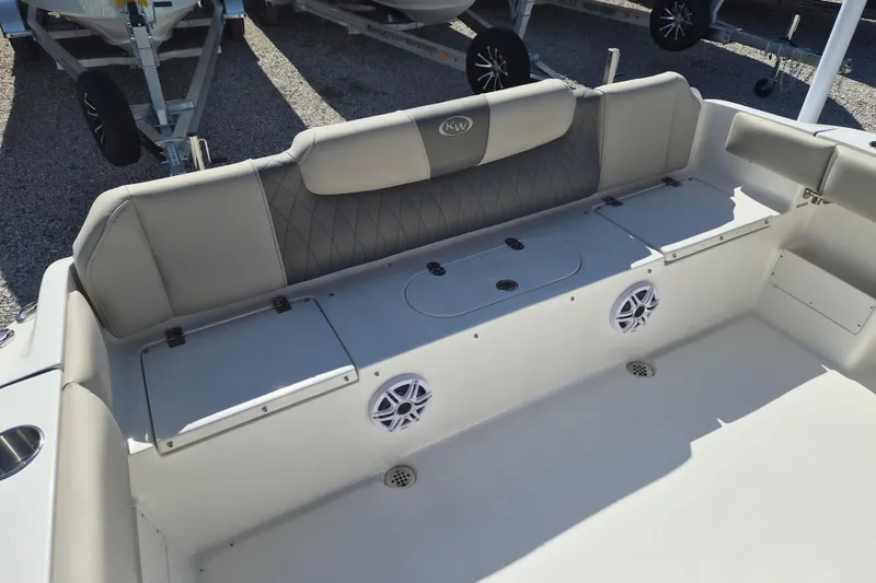 Slide: The Image of 2026 Key West 239 FS boat interior with cushioned seating and storage compartments. - 4