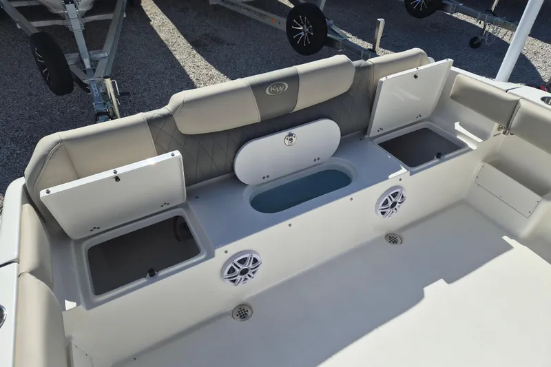 Slide: The Image of 2026 Key West 239 FS boat interior with storage compartments and speakers. - 5