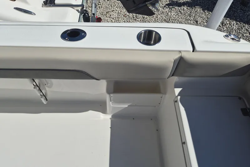Slide: The Image of Interior view of 2026 Key West 239 FS boat, featuring cup holders and seating area. - 6