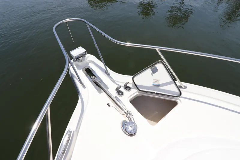 Slide: The Image of Bow of 2008 Tiara Yachts 4300 Sovran with anchor and hatch, on calm water. - 12