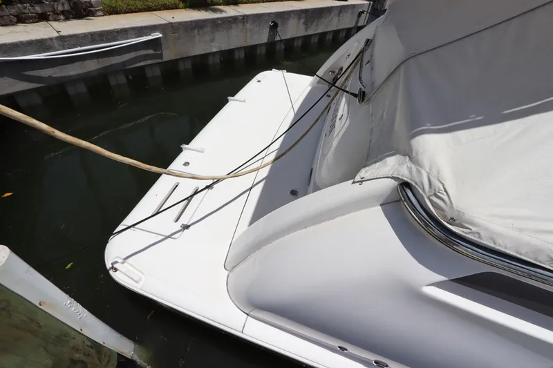 Slide: The Image of 2008 Tiara Yachts 4300 Sovran docked, covered, and secured with ropes. - 17