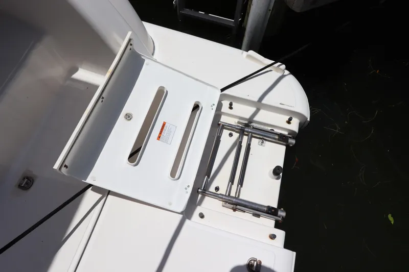 Slide: The Image of 2008 Tiara Yachts 4300 Sovran swim platform with ladder and storage compartment. - 18