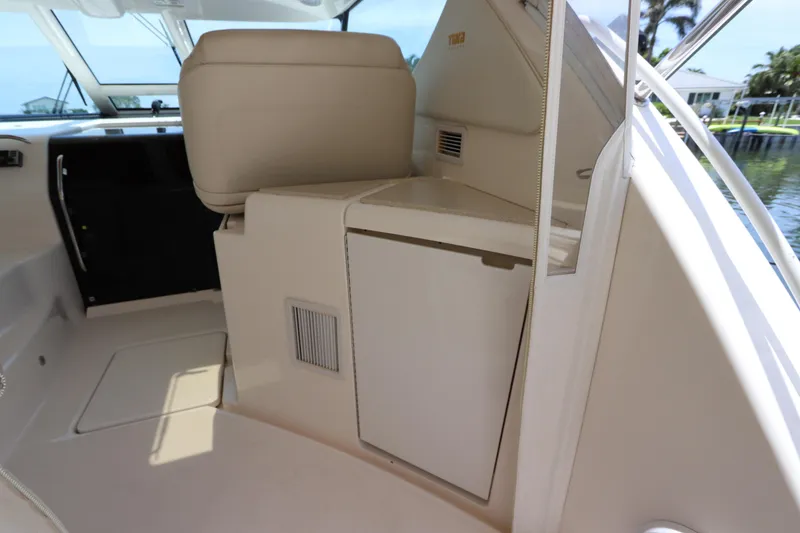 Slide: The Image of Interior view of 2008 Tiara Yachts 4300 Sovran, featuring helm seating and cabin entry. - 23